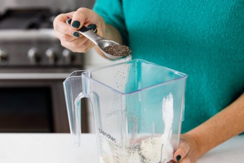 Adding Chia Seeds to the blender to thicken up your drink